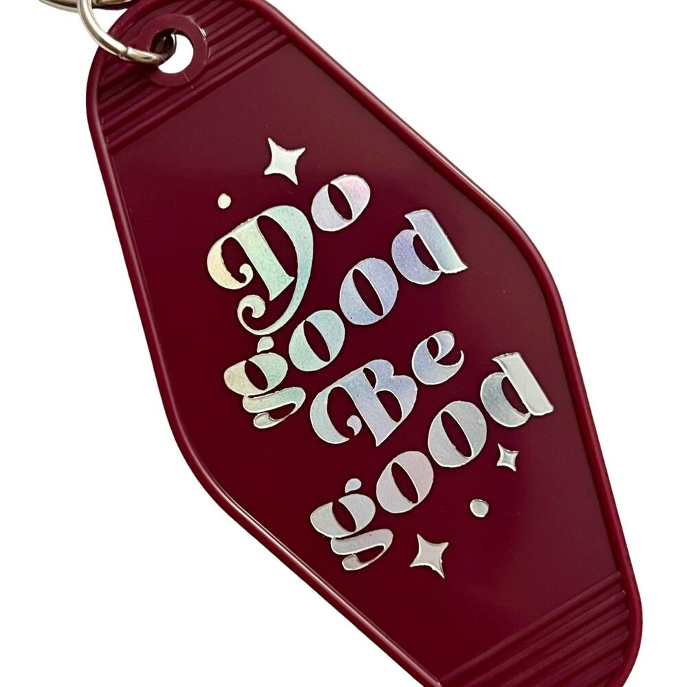 Burgundy Motel Room Keychain  Holographic print says “Do Good Be Good”